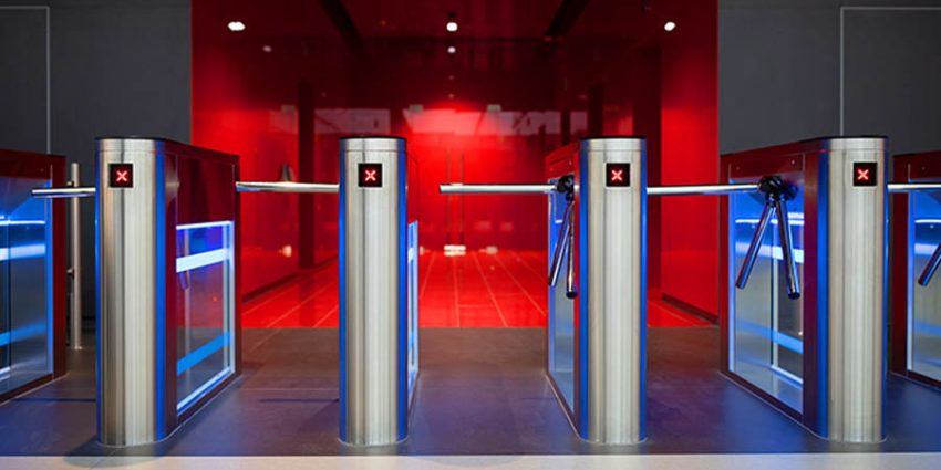 How smart security solutions are redefining commercial spaces;Automatic turnstile at the entrance. Tripod turnstile with electronic card reader is closed. stop motion